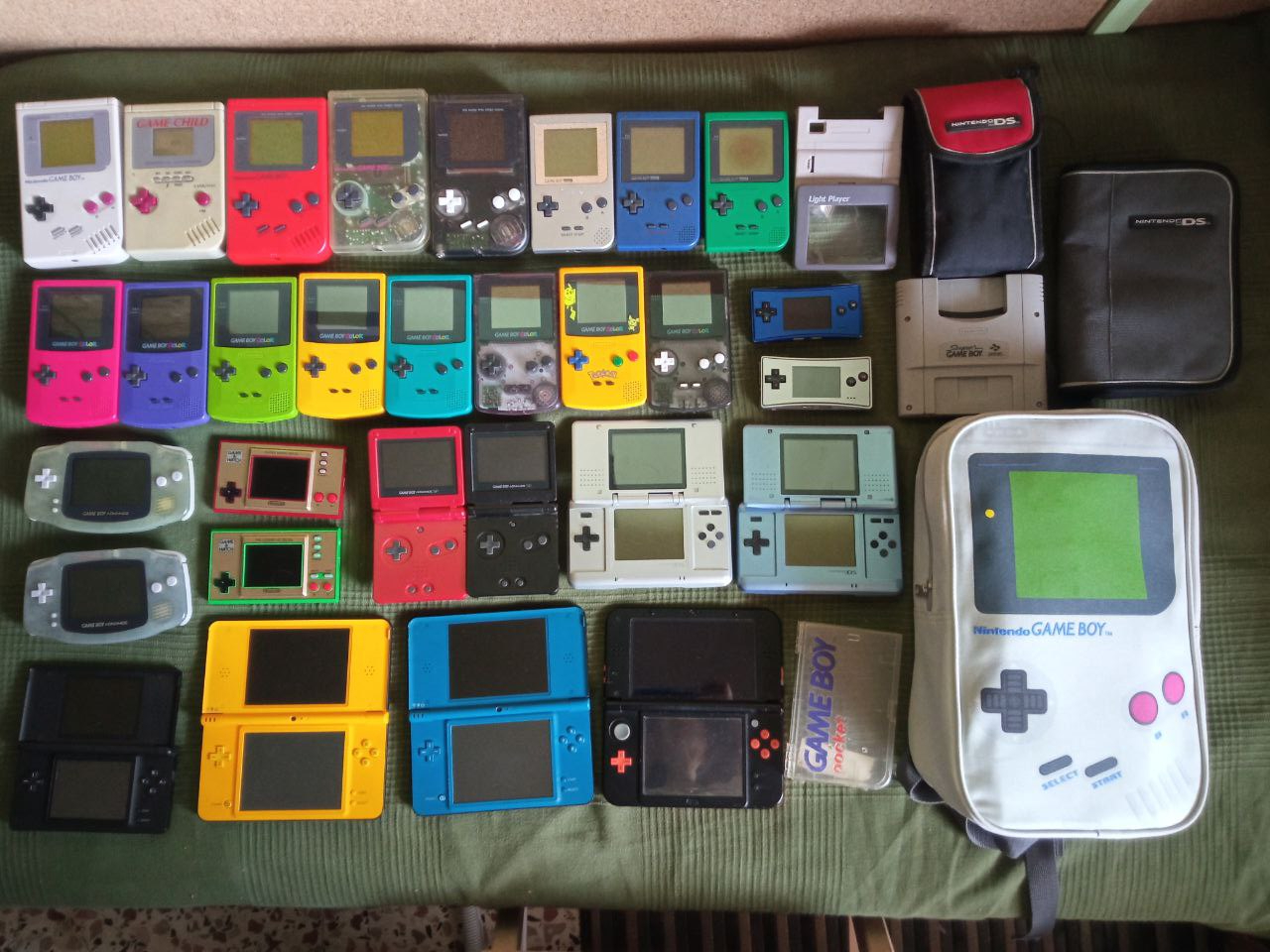 Picture with a lot of Game Boy consoles, Nintendo DS, 3DS and several accessories