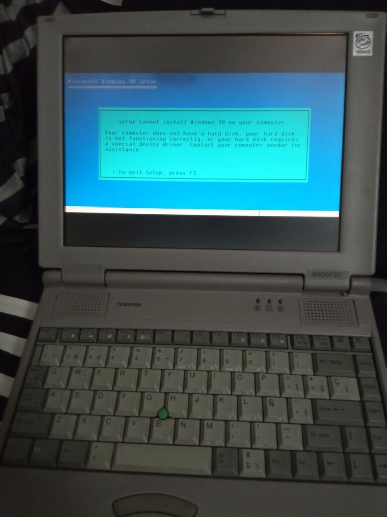 Picture of an old laptop with an error message.