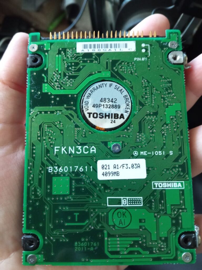 The same hard drive, as seen from the back. The warranty seal is unbroken.